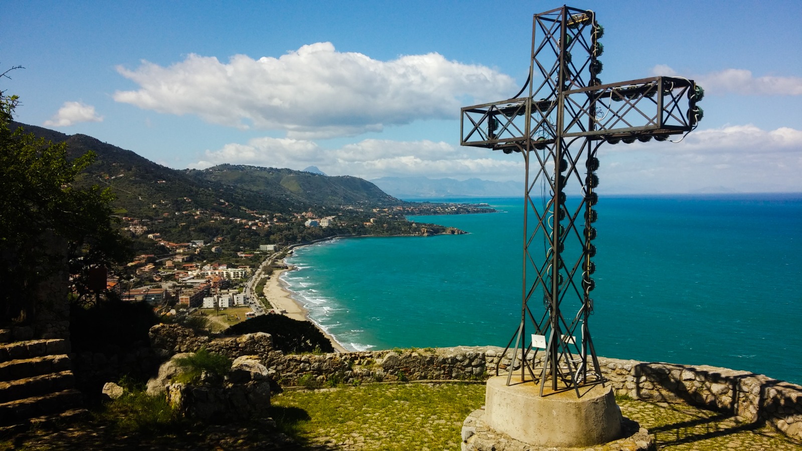 Crucifix on the Rock overlooking the coastline of Cefalù in Sicily