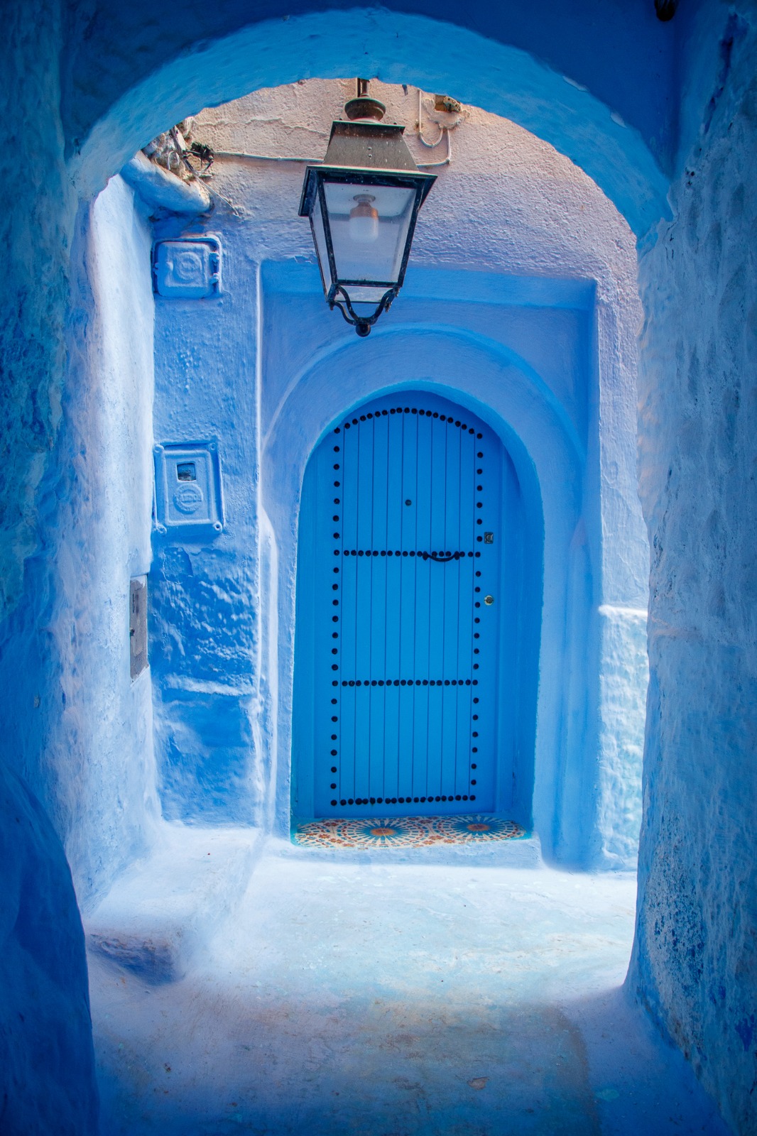 Blue arched doorway in Chefchaouen, Morocco