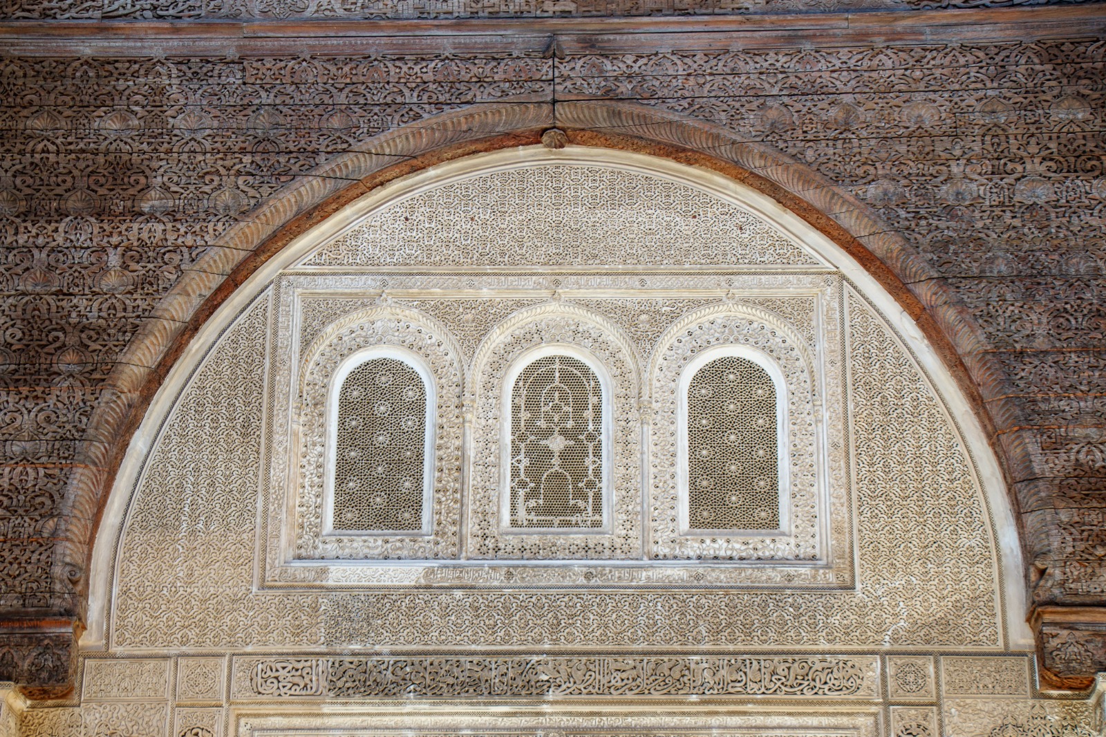 Detailed carved wood and stucco at Al Attarine Madrasa in Fes, Morocco