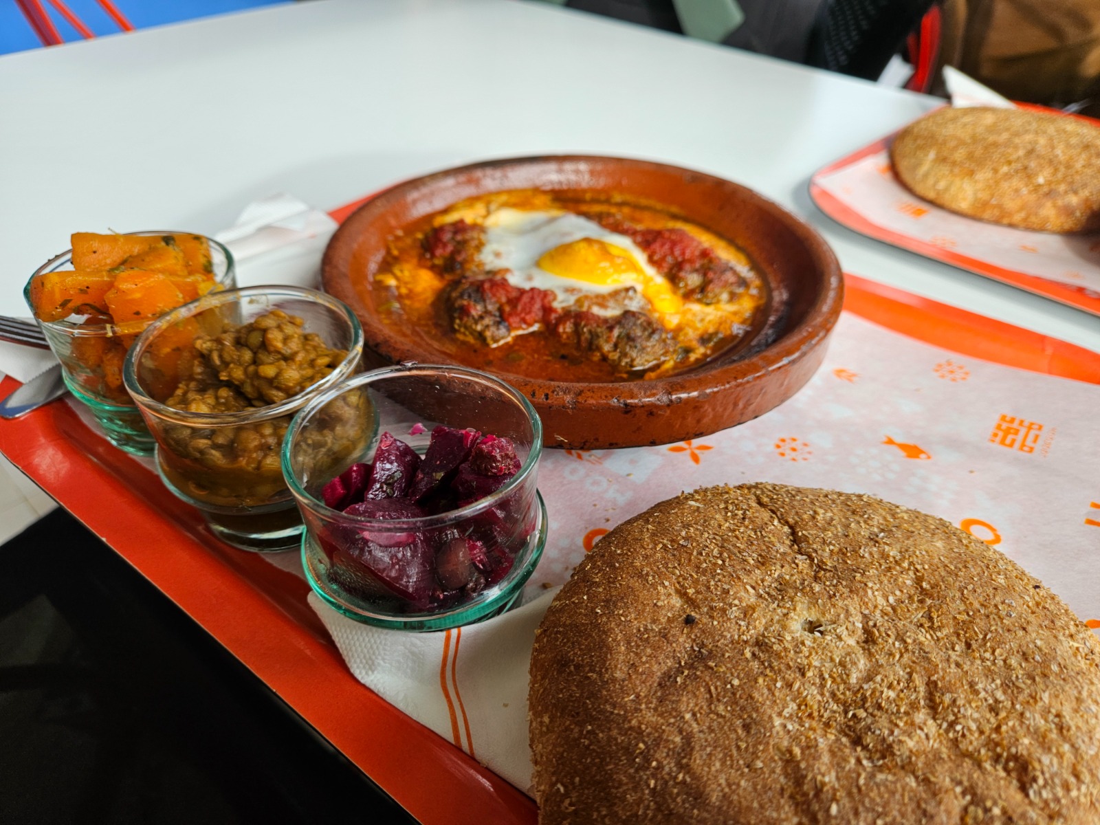 Moroccan kefta tagine with eggs in tomato sauce
